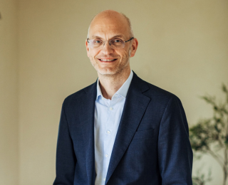 Man with glasses smiling